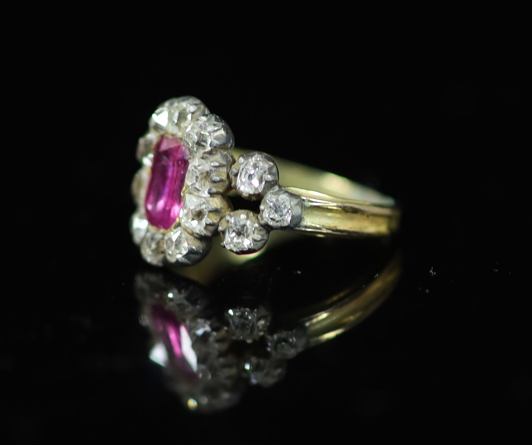 A George IV gold and silver, foil backed pink stone and old mine cut diamond set cluster memorial ring